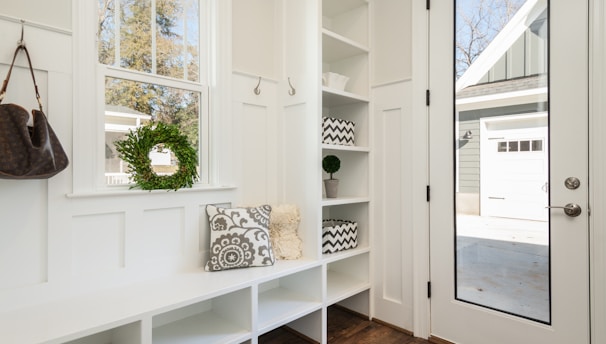 White mudroom with storage by Portugal Woodworks in Sandy, Lehi, and Spanish Fork, Utah.